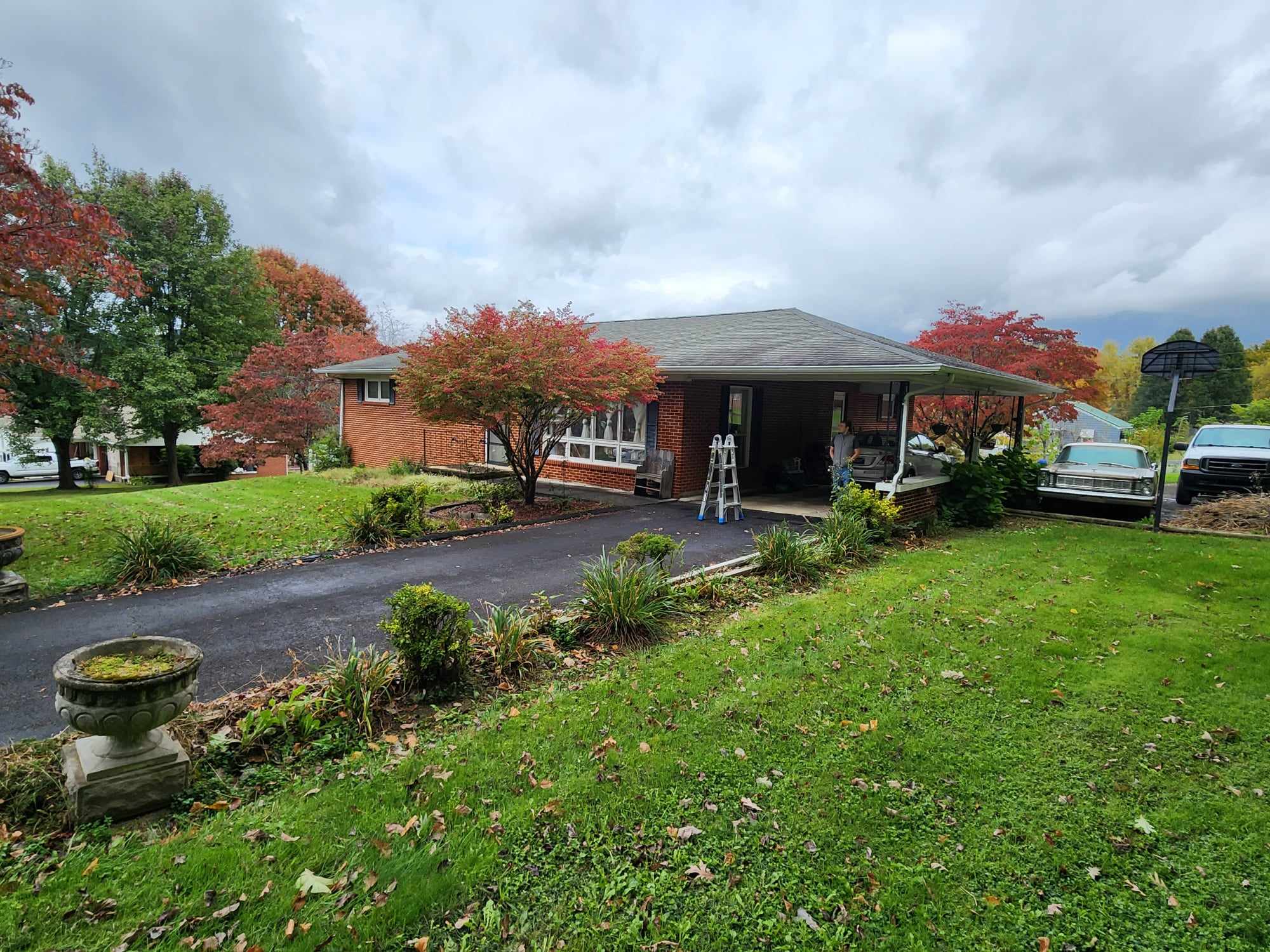 Residence Roofing & Restoration Transforms Home with Dark Bronze Gutters and Gutter Guards in Erwin, TN